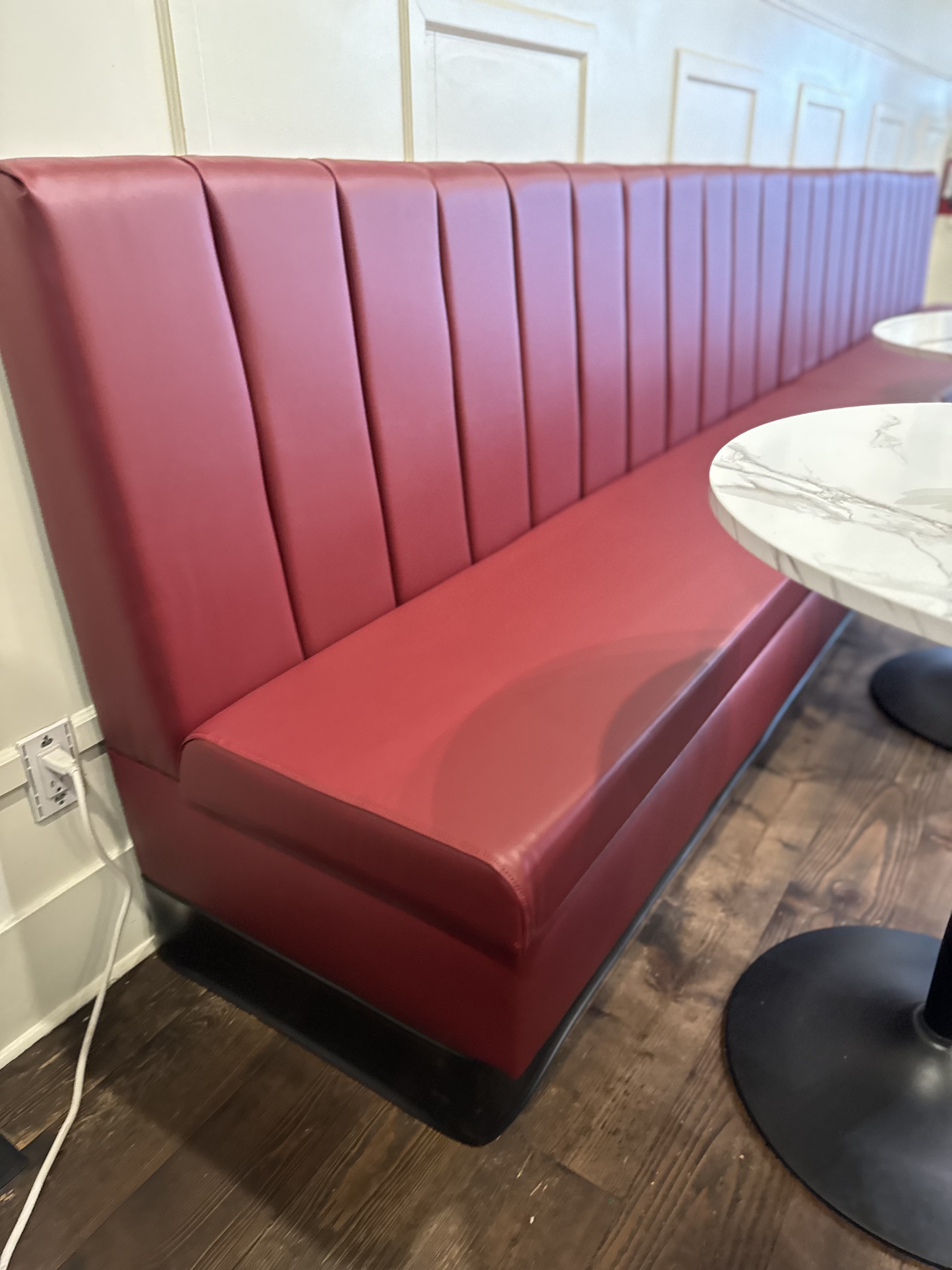 Red channel-tufted diner banquette
