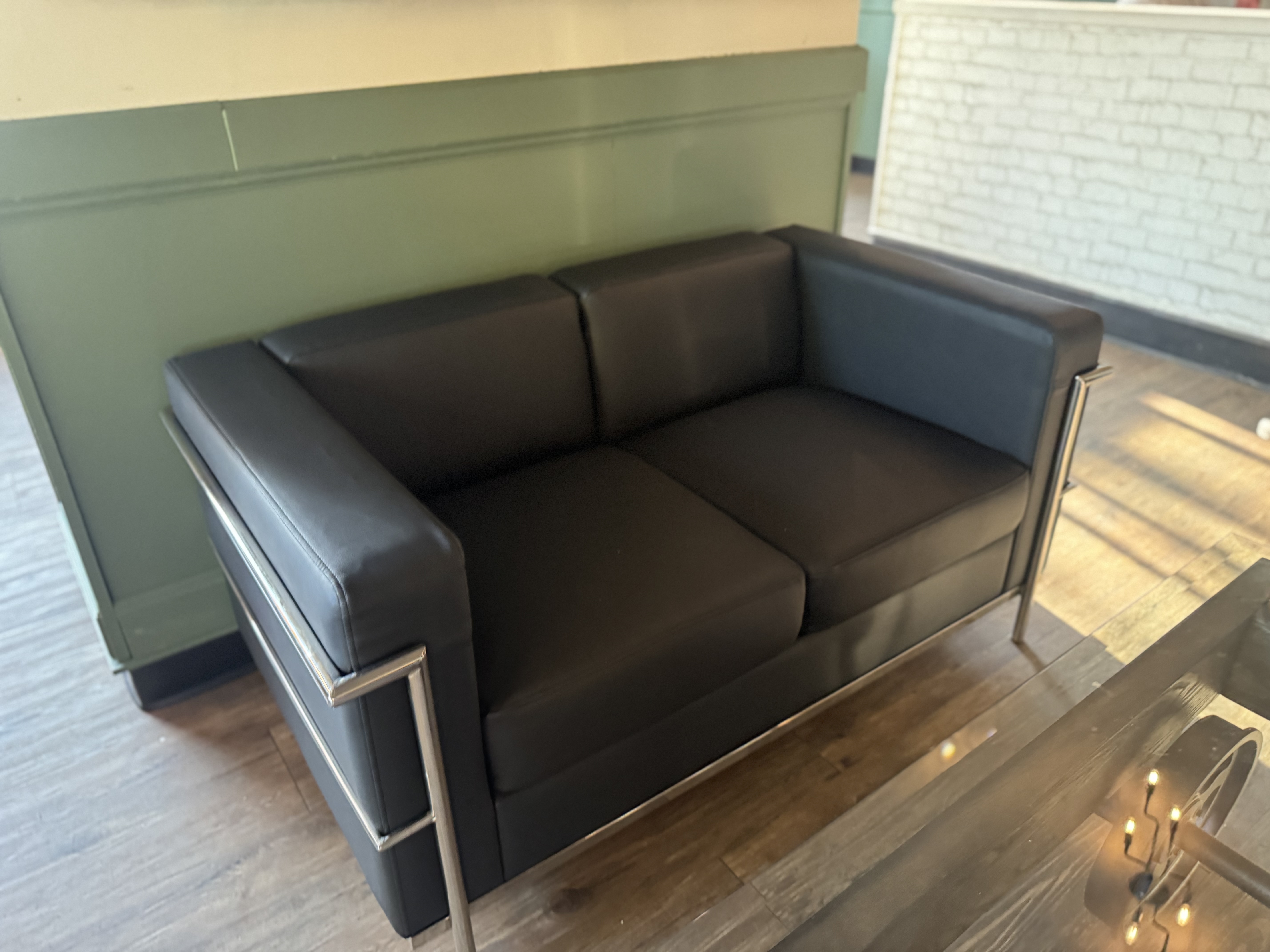 Modern black leather loveseat