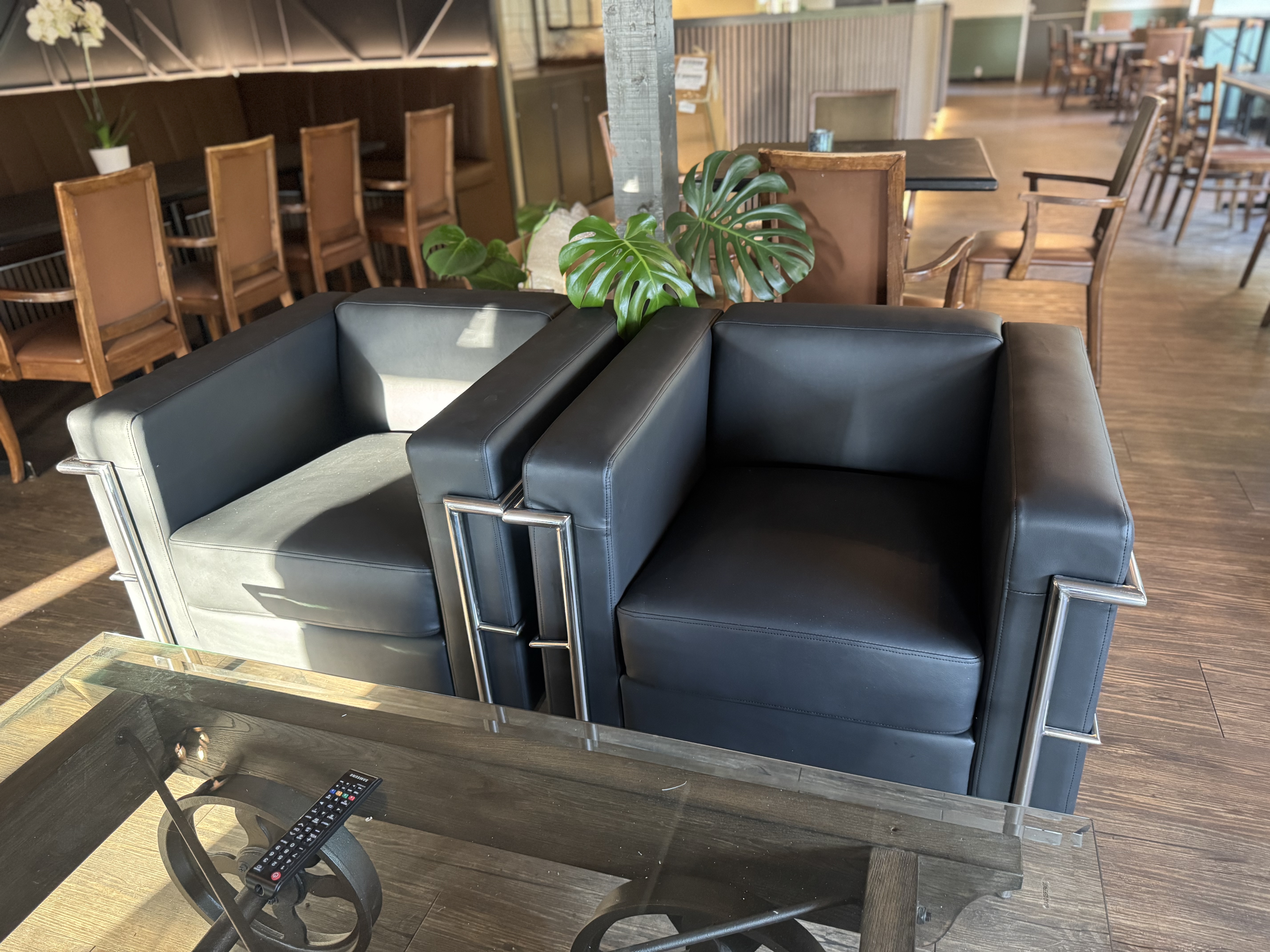 Black leather lounge chairs in restaurant seating area